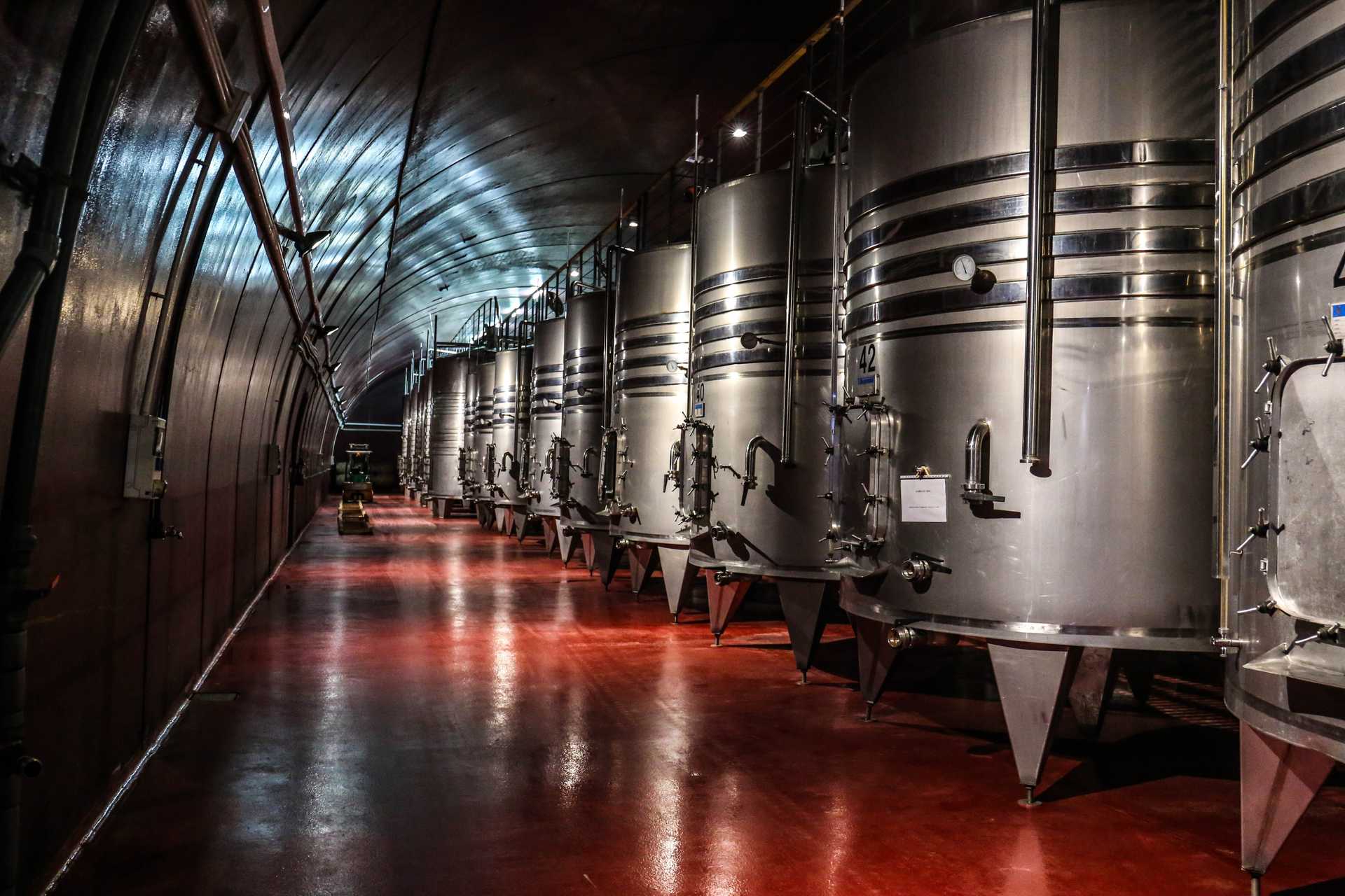 inside of beer brewery showing brew tanks