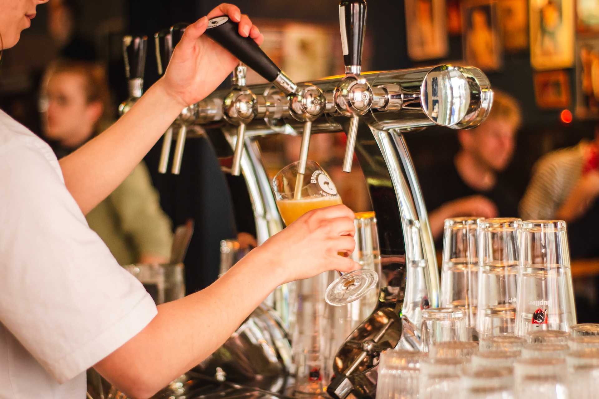 bar tender serving beer